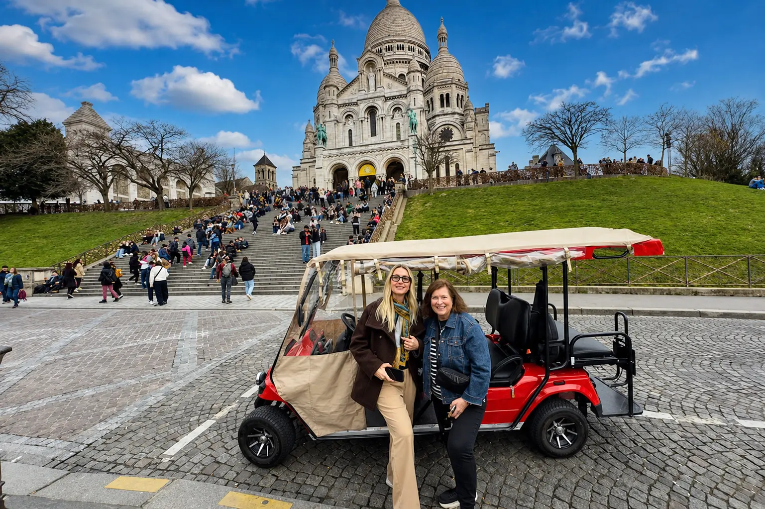 Happy guests enjoying a private electric golf cart tour near Sacre Coeur in Montmartre Paris